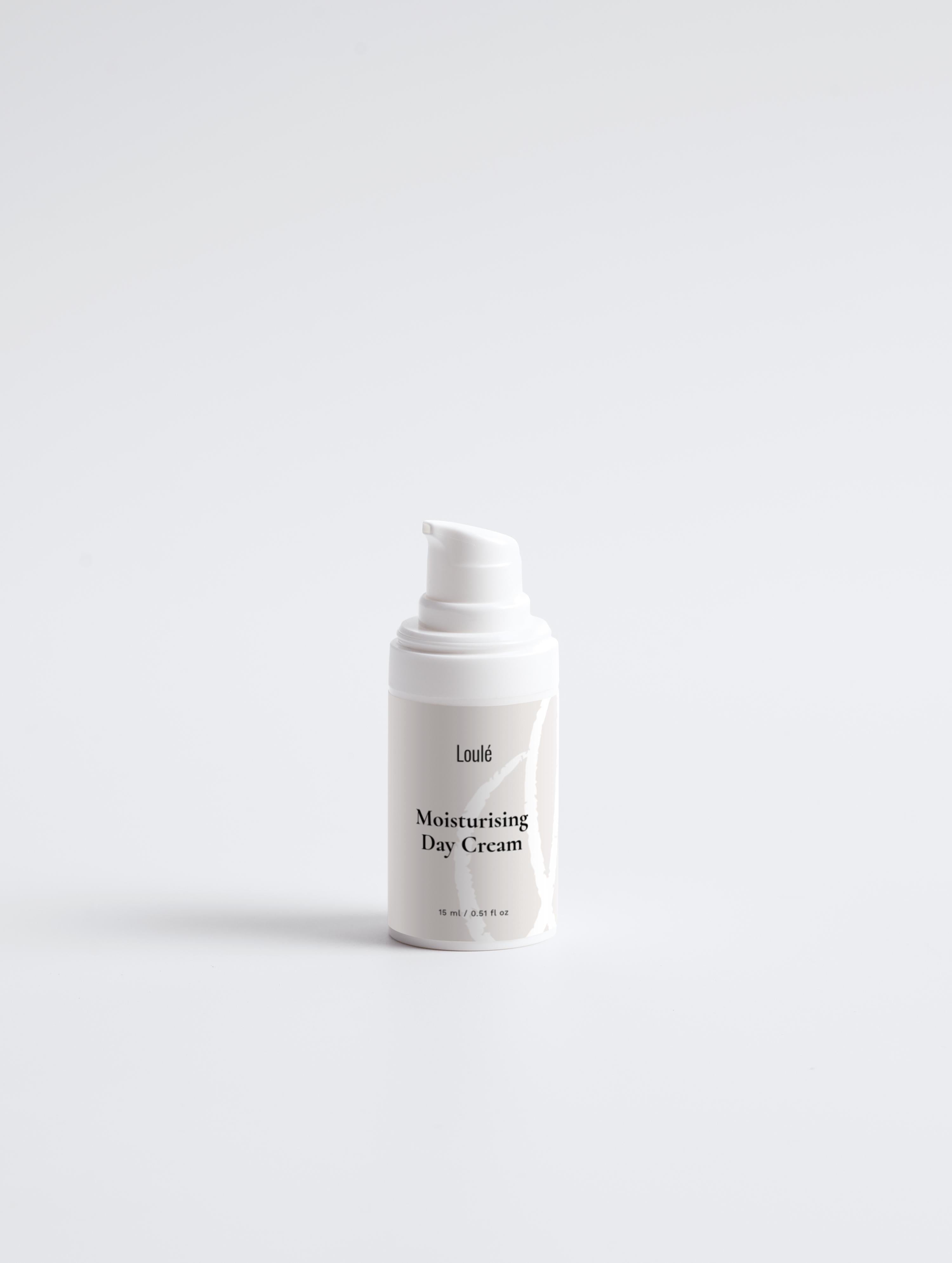 Moisturising Day Cream in sleek white pump bottle with minimalist design, ideal for dehydrated or normal skin needing a daily moisture boost.