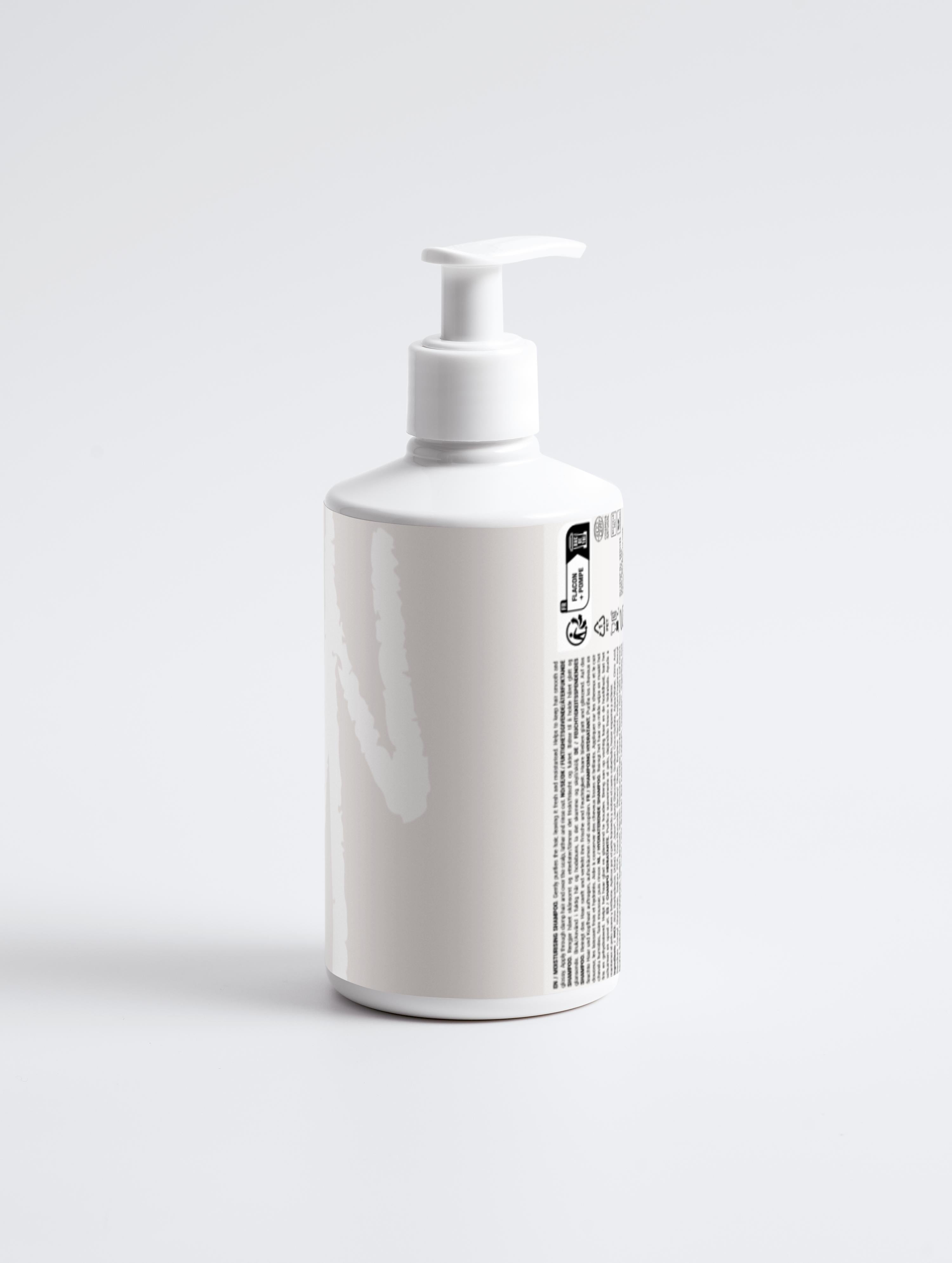 Moisturising Shampoo in white pump bottle with natural formula label, ideal for hydrating and smoothing hair with aloe juice and plant-based ingredients.