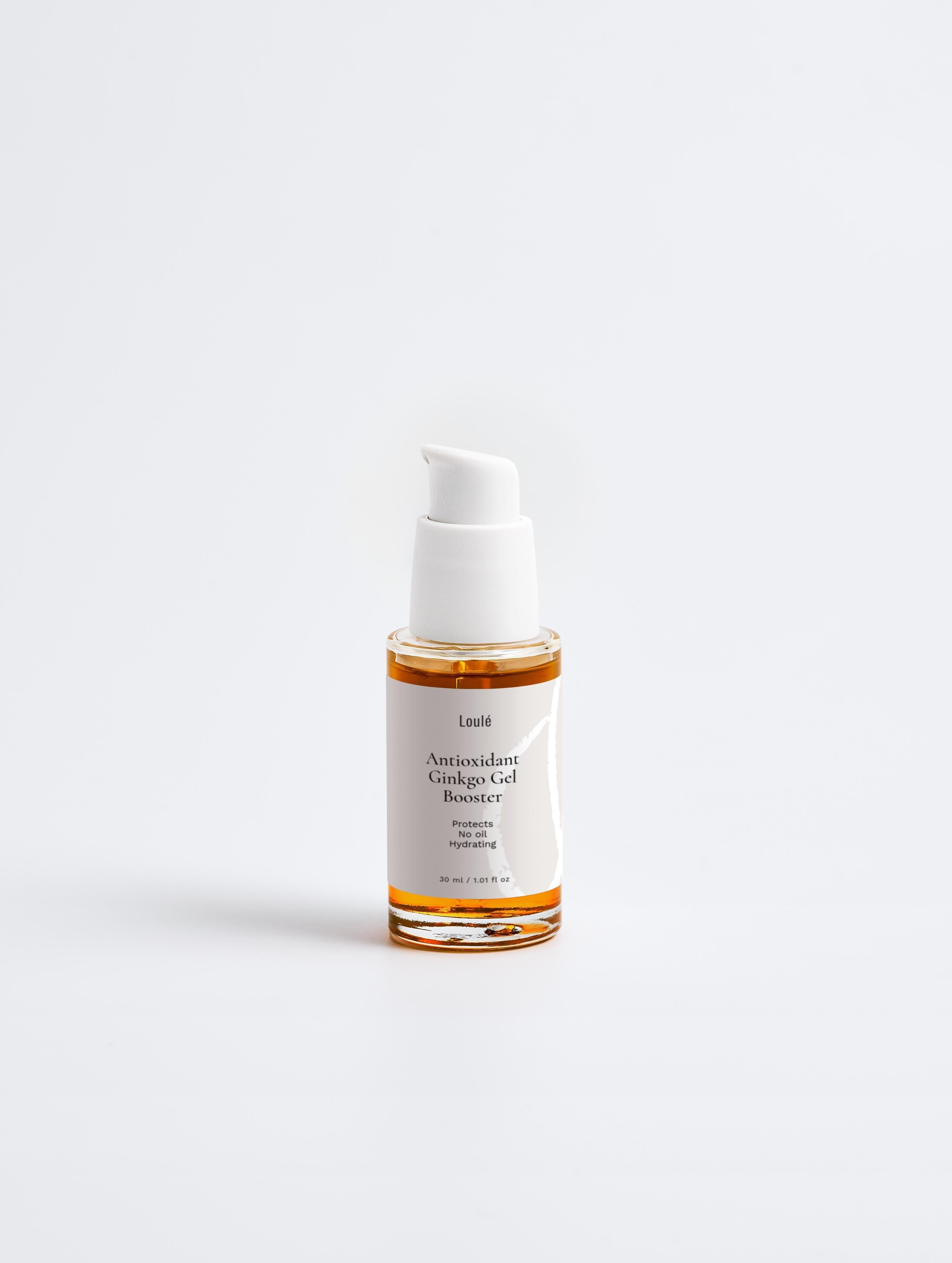 Antioxidant Ginkgo Gel Booster in transparent bottle with white pump, ideal for hydrating and anti-aging face care for all skin types.