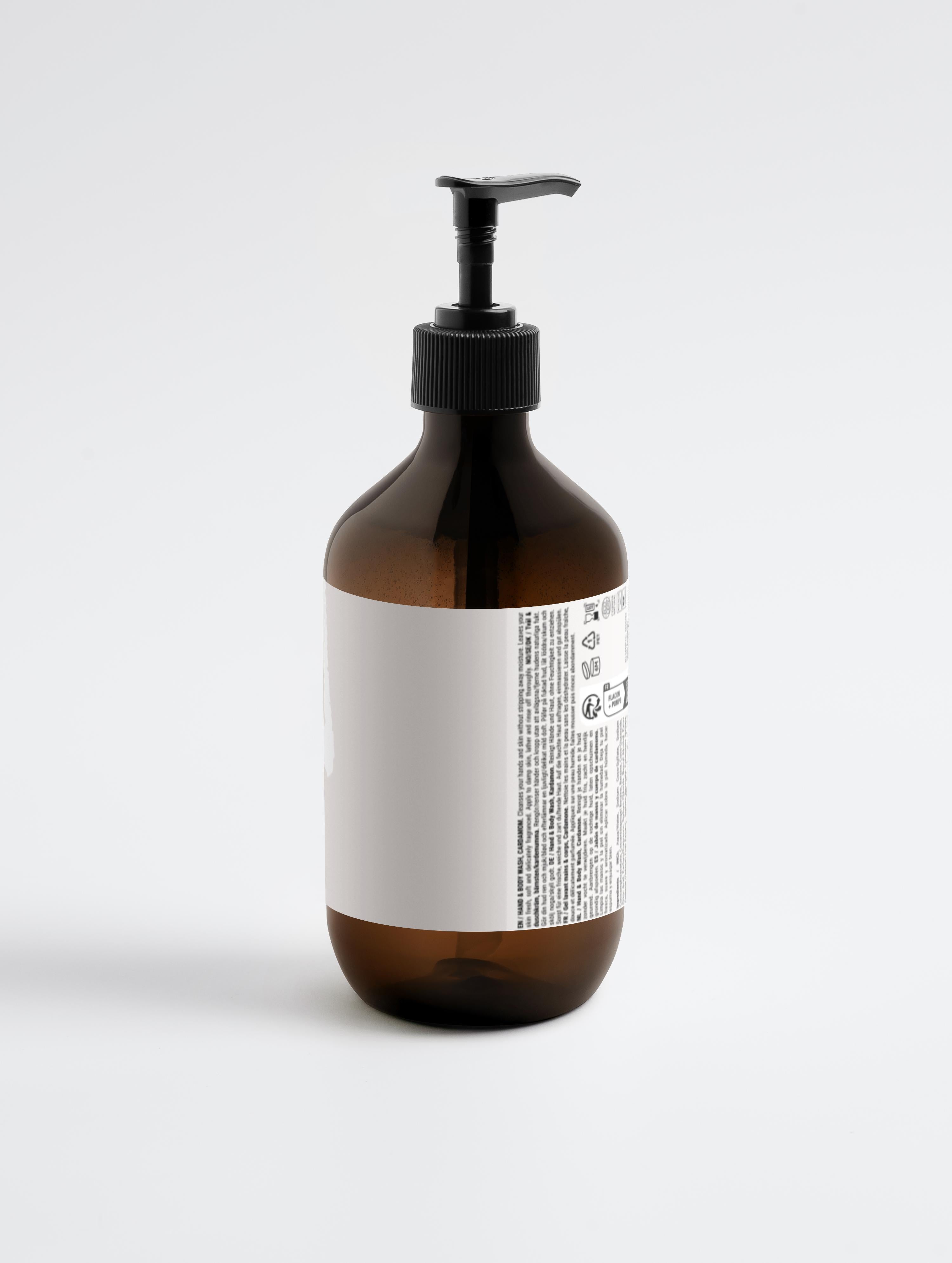 Amber bottle of Hand & Body Wash, Ginger & Smoky Cardamom with pump dispenser, ideal for hydrating and gentle cleansing of all skin types.