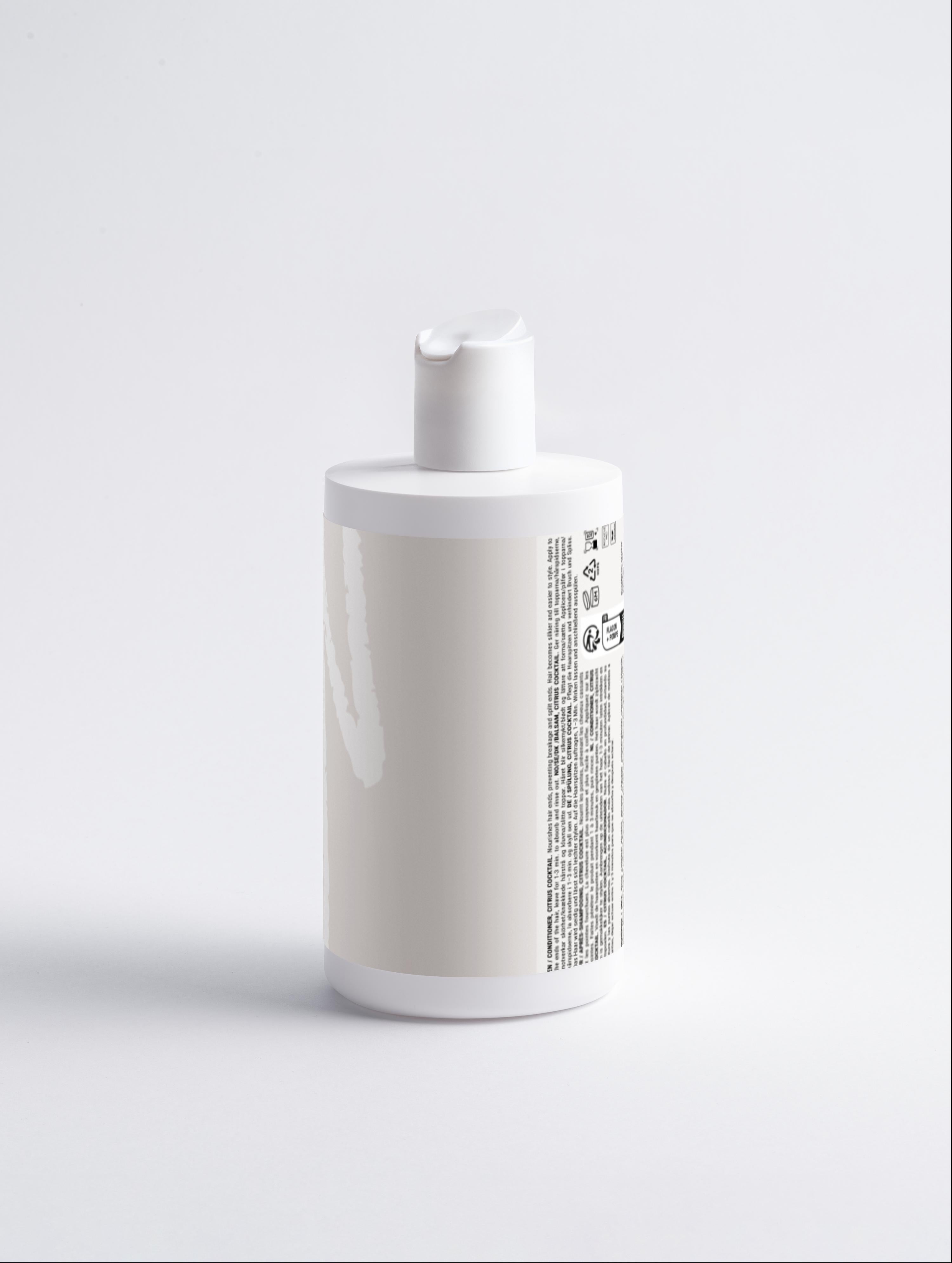 Fresh Conditioner, Citrus Cocktail in sleek white bottle with pump dispenser, ideal for nourishing dry ends and adding volume to hair.