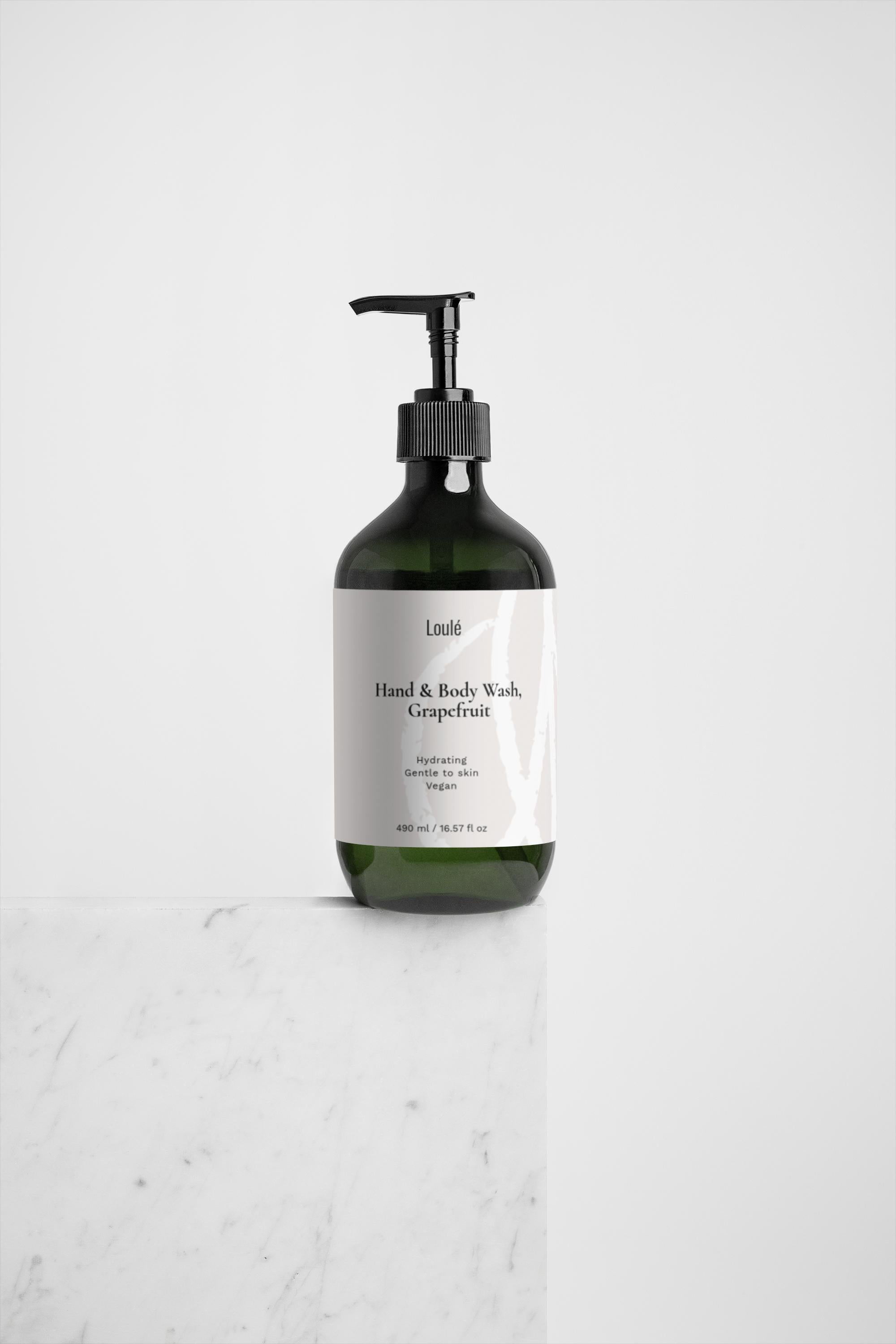 Hand & Body Wash, Grapefruit in a sleek green pump bottle with minimalist white label, ideal for hydrating and cleansing all skin types.