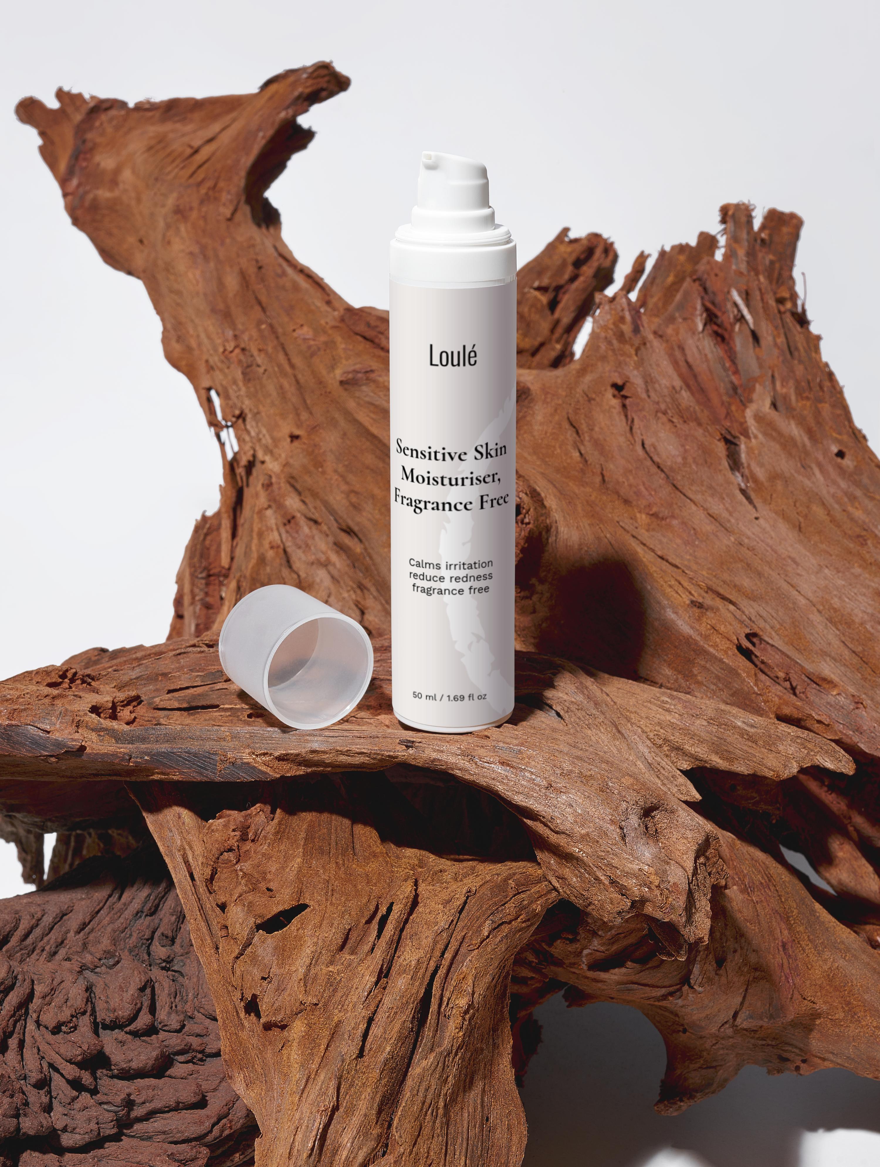 Sensitive Skin Moisturiser, Fragrance Free by Loulé on natural wood background, ideal for calming irritation and hydrating sensitive skin types.