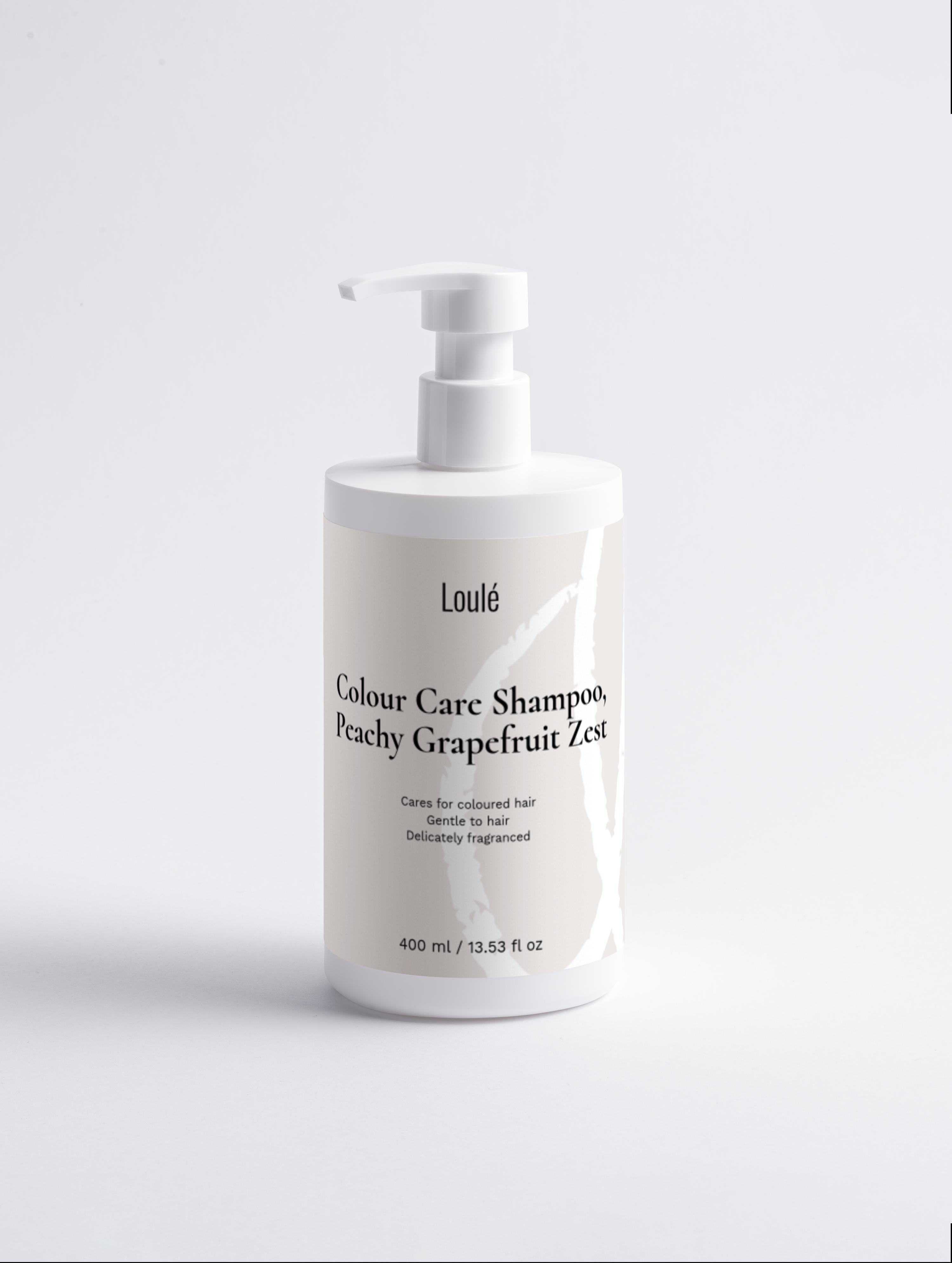 Loulé Colour Care Shampoo, Peachy Grapefruit Zest in 400ml white pump bottle, designed for coloured hair with gentle, delicately fragranced formula.