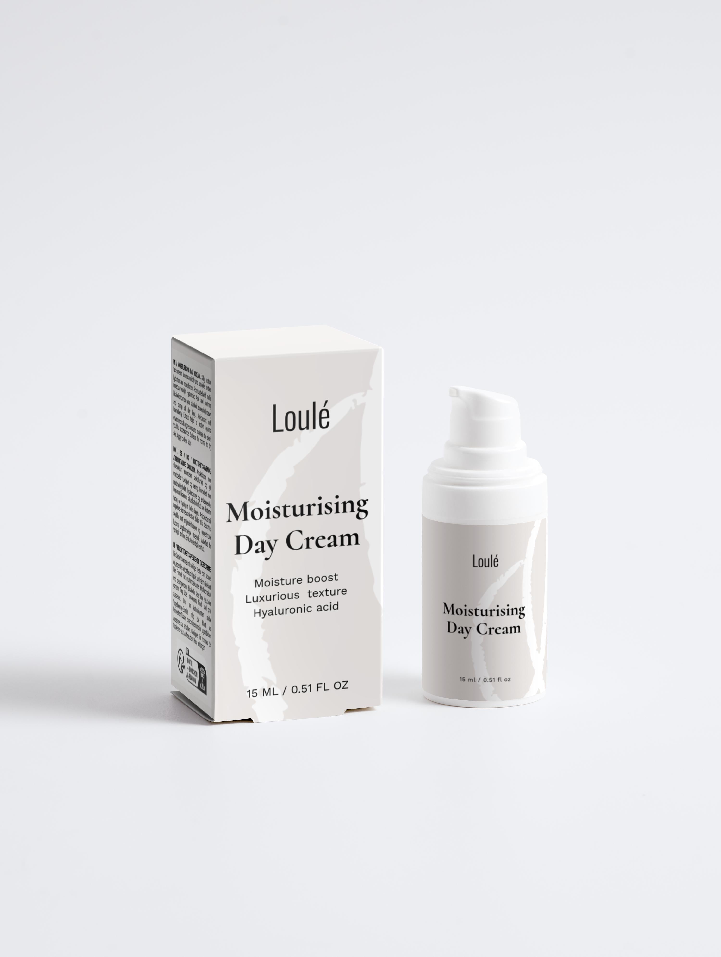 Loulé Moisturising Day Cream with hyaluronic acid in white packaging, featuring a pump bottle and box for dehydrated and normal skin types.