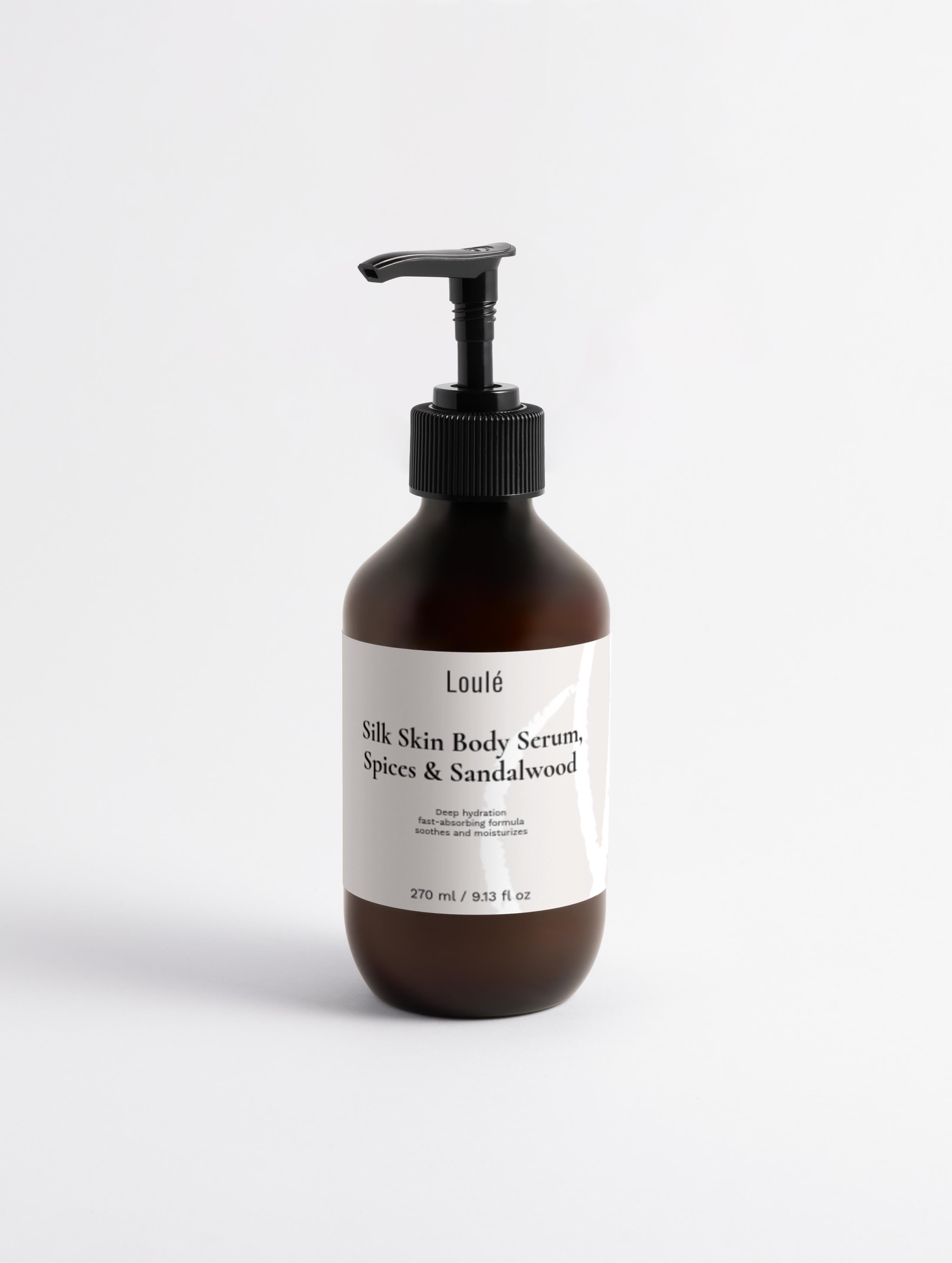 Silk Skin Body Serum, Spices & Sandalwood in amber pump bottle, 270ml. Hydrating body-care serum with hyaluronic acid and cocoa butter for dry skin.